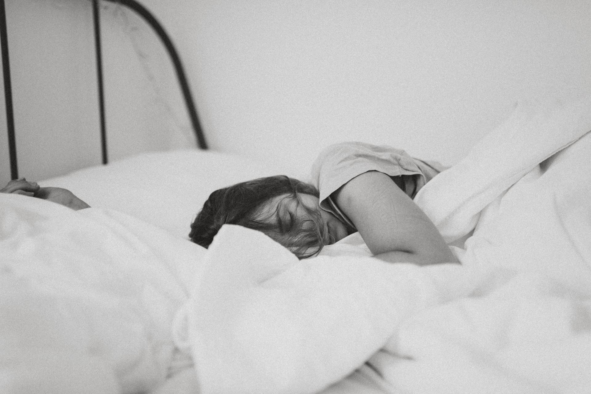 a woman lying on a bed